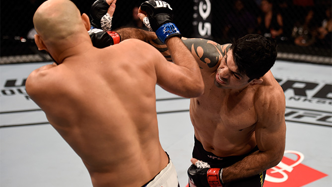 Viscardi Andrade of Brazil punches Gasan Umalatov of Russia in their welterweight bout during UFC Fight Nigth Belfort v Henderson at Ibirapuera Gymnasium on November 7, 2015 in Sao Paulo, Brazil. (Photo by Buda Mendes/Zuffa LLC)