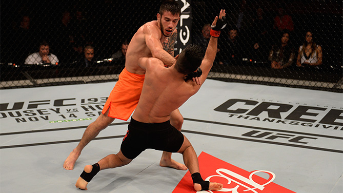 Matheus Nicolau of Brazil punches Bruno Korea of Brazil in their bantamweight bout during the UFC Fight Night Belfort v Henderson at Ibirapuera Gymnasium on November 7, 2015 in Sao Paulo, Brazil. on November 7, 2015 in Sao Paulo, Brazil. (Photo by Buda Mendes/Zuffa LLC)