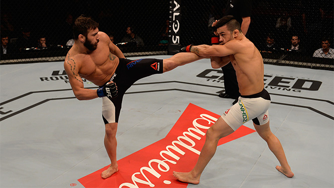 Jimmie Rivera of the United States kicks Pedro Munhoz of Brazil in their bantamweight bout during the UFC Fight Night Belfort v Henderson at Ibirapuera Gymnasium on November 7, 2015 in Sao Paulo, Brazil. (Photo by Buda Mendes/Zuffa LLC)