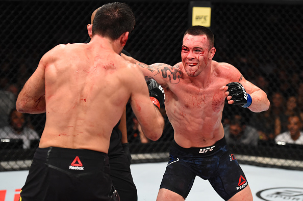 SAO PAULO, BRAZIL - OCTOBER 28: (R-L) Colby Covington punches Demian Maia of Brazil in their welterweight bout during the UFC Fight Night event inside the Ibirapuera Gymnasium on October 28, 2017 in Sao Paulo, Brazil. (Photo by Josh Hedges/Zuffa LLC/Zuffa LLC via Getty Images)