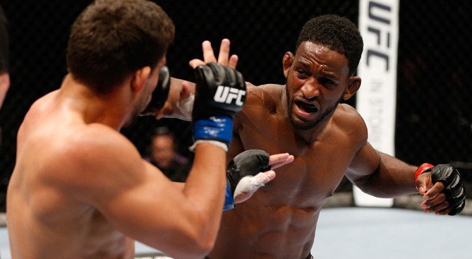 Neil Magny punches Rodrigo de Lima in their fight during UFC Fight Night on 6/28/14 in Auckland, NZ. (Photo by Josh Hedges/Zuffa LLC)