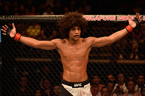 Alex Caceres reacts to the doctor stoppage for <a href='../fighter/Rolando-Dy'>Rolando Dy</a> of the Philippines in their featherweight bout during the UFC Fight Night event at the Singapore Indoor Stadium on June 17, 2017 in Singapore. (Photo by Brandon Magnus/Zuffa LLC)