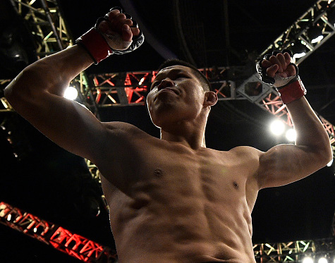 Li Jingliang celebrates after his knockout victory over <a href='../fighter/zak-ottow'>Zak Ottow</a> on Nov. 25, 2017 in Shanghai, China. (Photo by Brandon Magnus/Zuffa LLC)