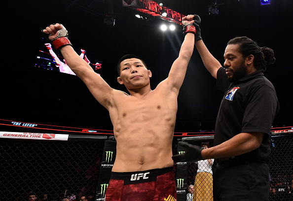 SHANGHAI, CHINA - NOVEMBER 25: Li Jingliang of China celebrates after his knockout victory over Zak Ottow in their welterweight bout during the UFC Fight Night event inside the Mercedes-Benz Arena on November 25, 2017 in Shanghai, China. (Photo by Brandon Magnus/Zuffa LLC via Getty Images)
