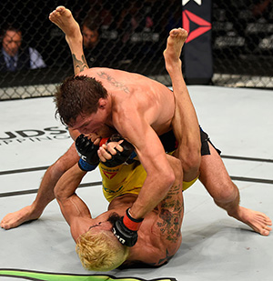 Darren Elkins lands a punch to the head of <a href='../fighter/Godofredo-Pepey'><a href='../fighter/Godofredo-Castro'>Godofredo Pepey</a></a> during the <a href='../event/UFC-Silva-vs-Irvin'>UFC Fight Night </a>on July 23, 2016 in Chicago, Illinois. (Photo by Josh Hedges/Zuffa LLC)