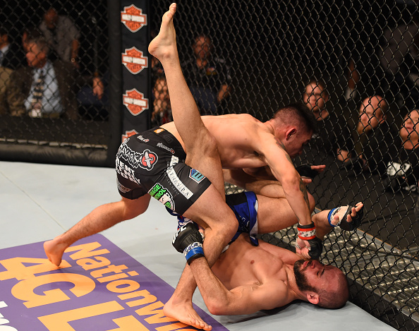Ray Borg punches Chris Kelades in their flyweight fight during the UFC Fight Night event inside 1stBank Center on February 14, 2015 in Broomfield, Colorado. (Photo by Josh Hedges/Zuffa LLC)