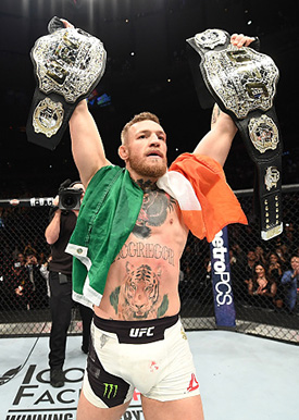 UFC lightweight and featherweight champion <a href='../fighter/Conor-McGregor'>Conor McGregor</a> of Ireland celebrates after defeating <a href='../fighter/eddie-alvarez'>Eddie Alvarez</a> in their UFC lightweight championship fight during the UFC 205 event at Madison Square Garden on November 12, 2016 in New York City. (Photo by Jeff Bottari/Zuffa LLC/Zuffa LLC)