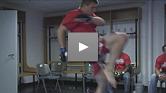 Fighters get their hands wrapped and warm up in their locker rooms