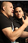 (L-R) UFC Hall of Famer Chuck Liddell and musician Taboo take in the fights at UFC 128 at the Prudential Center on March 19, 2011 in Newark, New Jersey.