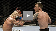 In the opening fight of UFC&reg; 98 the The Ultimate Fighter&reg; season 8 semifinalist George Roop battles against the wrestling skills of Dave Kaplan.
