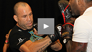The men of the UFC 132 main and co-main events sweat it out at open workouts... see who's ready for war.