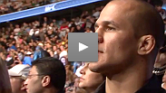 Heavyweight title contender Junior dos Santos watches the most recent championship fight in the division - he fights the winner Saturday night.