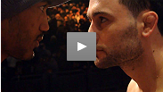 Lightweight champion Frankie Edgar bounds across the stage to stare down his next opponent, former WEC champ Benson Henderson before their UFC 144 main event clash.