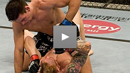 Demian Maia uses punches to soften up Jason MacDonald before securing the fight-ending choke at UFC&reg; 87.