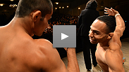 Welterweights Jake Ellenberger and Jay Hieron square off as flyweight contenders John Dodson and Jussier Formiga share a spirited pose on stage.
