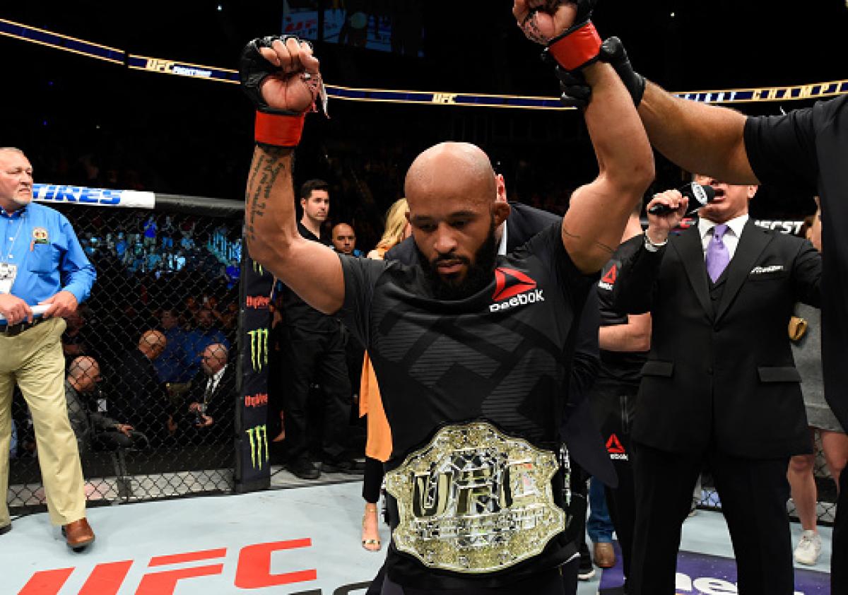 'Mighty' haul: Johnson gets pic with 10 belts