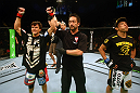 Brian Bowles celebrates after defeating Takeya Mizugaki.