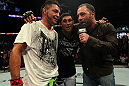 Leonard Garcia, Nam Phan and Joe Rogan after the fight