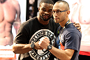Strikeforce welterweight fighter Tyron Woodley poses for a photo with a fan