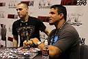 Frank Mir signs autographs for a fan