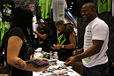 UFC Fighters Clay Guida and Rashad Evans signs autographs for fans