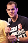 UFC fighter Cole Miller attends a Q&A session with former cast members of The Ultimate Fighter on the main stage at the UFC Fan Expo