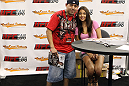 UFC Octagon Girl Arianny Celeste poses for photos with fans at the UFC Fan Expo