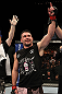 John Maguire celebrates his win