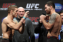 SAN JOSE, CA - NOVEMBER 18:  (L-R) Middleweight opponents Tom Lawlor and Chris Weidman face off after weighing in during the UFC 139 Weigh In at the HP Pavilion on November 18, 2011 in San Jose, California.  (Photo by Josh Hedges/Zuffa LLC/Zuffa LLC via Getty Images)