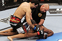 SAN JOSE, CA - NOVEMBER 19: Referee Jason McCoy stops the fight between Danny Castillo (top) and Shamar Bailey (bottom), declaring Castillo the winner during an UFC Lightweight bout at the HP Pavillion on November 19, 2011 in San Jose, California.  (Photo by Josh Hedges/Zuffa LLC/Zuffa LLC via Getty Images)