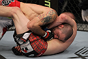 SAN JOSE, CA - NOVEMBER 19: Matt Brown (top) is held in a head-lock by Seth Baczynski (bottom) during an UFC Welterweight bout at the HP Pavillion in San Jose, California on November 19, 2011 in San Jose, California.  (Photo by Josh Hedges/Zuffa LLC/Zuffa LLC via Getty Images)