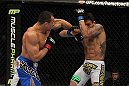 SAN JOSE, CA - NOVEMBER 19: (L-R) Gleison Tibau punches Rafael dos Anjos during an UFC Lightweight bout at the HP Pavilion in San Jose, California on November 19, 2011 in San Jose, California. (Photo by Josh Hedges/Zuffa LLC/Zuffa LLC via Getty Images)