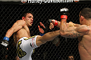 SAN JOSE, CA - NOVEMBER 19: (L-R) Rafael dos Anjos kicks Gleison Tibau during an UFC Lightweight bout at the HP Pavillion in San Jose, California on November 19, 2011 in San Jose, California.  (Photo by Josh Hedges/Zuffa LLC/Zuffa LLC via Getty Images)