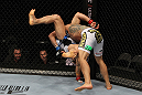 SAN JOSE, CA - NOVEMBER 19:  (R-L)Rafael dos Anjos slams Gleison Tibau to the mat during an UFC Lightweight bout at the HP Pavillion in San Jose, California on November 19, 2011 in San Jose, California.  (Photo by Josh Hedges/Zuffa LLC/Zuffa LLC via Getty Images)