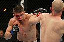 SAN JOSE, CA - NOVEMBER 19:  (L-R) Rick Story punches Martin Kampmann during an UFC Welterweight bout at the HP Pavillion on November 19, 2011 in San Jose, California.  (Photo by Josh Hedges/Zuffa LLC/Zuffa LLC via Getty Images)