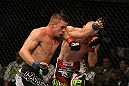 SAN JOSE, CA - NOVEMBER 19:  (R-L) Martin Kampmann punches Rick Story during an UFC Welterweight bout at the HP Pavillion on November 19, 2011 in San Jose, California.  (Photo by Josh Hedges/Zuffa LLC/Zuffa LLC via Getty Images)