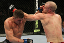SAN JOSE, CA - NOVEMBER 19:  (R-L) Martin Kampmann and Rick Story exchange punches during an UFC Welterweight bout at the HP Pavillion on November 19, 2011 in San Jose, California.  (Photo by Josh Hedges/Zuffa LLC/Zuffa LLC via Getty Images)