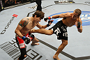 SAN JOSE, CA - NOVEMBER 19: (R-L) Urijah Faber kicks Brian Bowles in the side during an UFC Bantamweight bout at the HP Pavillion on November 19, 2011 in San Jose, California.  (Photo by Josh Hedges/Zuffa LLC/Zuffa LLC via Getty Images)
