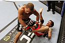 SAN JOSE, CA - NOVEMBER 19: (R-L) Brian Bowles kicks Urijah Faber during an UFC Bantamweight bout at the HP Pavillion on November 19, 2011 in San Jose, California.  (Photo by Josh Hedges/Zuffa LLC/Zuffa LLC via Getty Images)