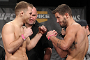 LAS VEGAS, NV - DECEMBER 02:  (L-R) Opponents Bryan Caraway and Dustin Neace face off after weighing in at the official weigh-in for The Ultimate Fighter 14 Finale at The Palms Casino Resort on December 2, 2011 in Las Vegas, Nevada.  (Photo by Josh Hedges/Zuffa LLC/Zuffa LLC via Getty Images)