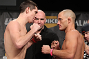 LAS VEGAS, NV - DECEMBER 02:  (L-R) Opponents Steven Siler and Josh Clopton face off after weighing in at the official weigh-in for The Ultimate Fighter 14 Finale at The Palms Casino Resort on December 2, 2011 in Las Vegas, Nevada.  (Photo by Josh Hedges/Zuffa LLC/Zuffa LLC via Getty Images)