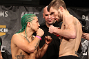 LAS VEGAS, NV - DECEMBER 02:  (L-R) Bantamweight opponents Louis Gaudinot and Johny Bedford face off after weighing in at the official weigh-in for The Ultimate Fighter 14 Finale at The Palms Casino Resort on December 2, 2011 in Las Vegas, Nevada.  (Photo by Josh Hedges/Zuffa LLC/Zuffa LLC via Getty Images)
