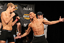 LAS VEGAS, NV - DECEMBER 02:  (L-R) Bantamweight opponents TJ Dillashaw and John Dodson face off after weighing in at the official weigh-in for The Ultimate Fighter 14 Finale at The Palms Casino Resort on December 2, 2011 in Las Vegas, Nevada.  (Photo by Josh Hedges/Zuffa LLC/Zuffa LLC via Getty Images)