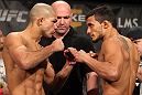 LAS VEGAS, NV - DECEMBER 02:  (L-R) Featherweight opponents Diego Brandao and Dennis Bermudez face off after weighing in at the official weigh-in for The Ultimate Fighter 14 Finale at The Palms Casino Resort on December 2, 2011 in Las Vegas, Nevada.  (Photo by Josh Hedges/Zuffa LLC/Zuffa LLC via Getty Images)