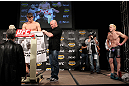 LAS VEGAS, NV - DECEMBER 02:  Michael Bisping (L) weighs in as his opponent Jason Miller (R) looks on at the official weigh-in for The Ultimate Fighter 14 Finale at The Palms Casino Resort on December 2, 2011 in Las Vegas, Nevada.  (Photo by Josh Hedges/Zuffa LLC/Zuffa LLC via Getty Images)