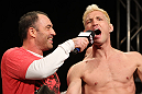 LAS VEGAS, NV - DECEMBER 02:  (R-L) Jason "Mayhem" Miller is interviewed by Joe Rogan after weighing in at the official weigh-in for The Ultimate Fighter 14 Finale at The Palms Casino Resort on December 2, 2011 in Las Vegas, Nevada.  (Photo by Josh Hedges/Zuffa LLC/Zuffa LLC via Getty Images)