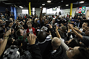 TORONTO, ON - DECEMBER 07:  UFC Light Heavyweight Champion Jon "Bones" Jones signs autographs for fans during the UFC 140 Open Workouts at the Xtreme Couture Gym on December 7, 2011 in Toronto, Ontario.  (Photo by Josh Hedges/Zuffa LLC/Zuffa LLC via Getty Images)