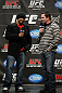 TORONTO, ON - DECEMBER 09:  (L-R) UFC Middleweight contender Mark Munoz and UFC commentator Mike Goldberg interacts with fans during a Q&A session before the UFC 140 Official Weigh-in at the Air Canada Centre on December 9, 2011 in Toronto, Canada.  (Photo by Josh Hedges/Zuffa LLC/Zuffa LLC via Getty Images)