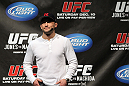 TORONTO, ON - DECEMBER 09:  UFC Lightweight Champion Frankie Edgar stands on stage after defeating Benson Henderson on the UFC Undisputed 3 videogame before the UFC 140 Official Weigh-in at the Air Canada Centre on December 9, 2011 in Toronto, Canada.  (Photo by Josh Hedges/Zuffa LLC/Zuffa LLC via Getty Images)