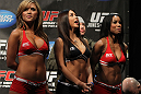 TORONTO, ON - DECEMBER 09:  (L-R) UFC Octagon Girls Brittney Palmer, Arianny Celeste, and Chandella Powell turn their backs to the scale as Mitch Clarke weighs in during the UFC 140 Official Weigh-in at the Air Canada Centre on December 9, 2011 in Toronto, Canada.  (Photo by Josh Hedges/Zuffa LLC/Zuffa LLC via Getty Images)